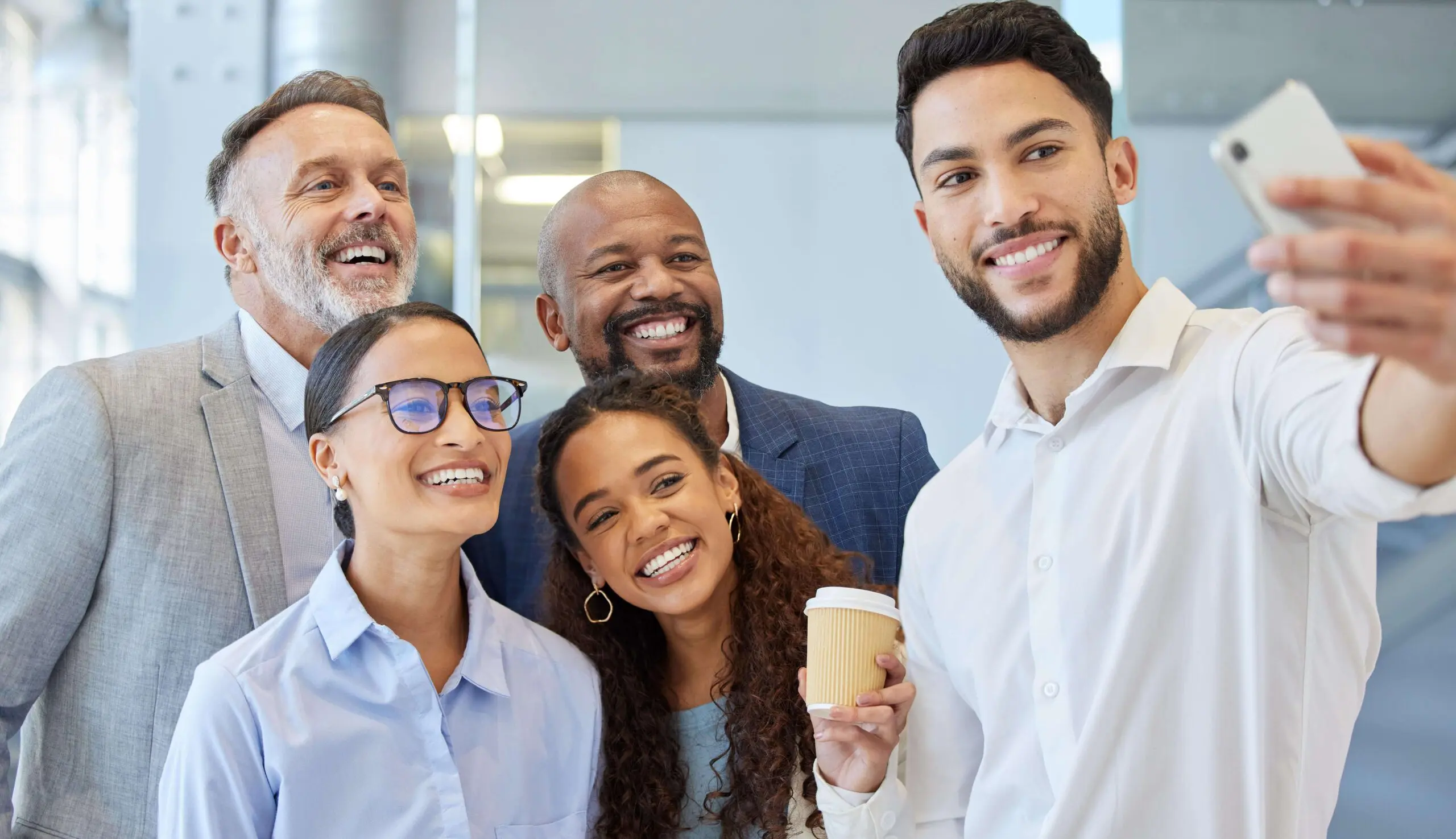 shot-of-a-group-of-businesspeople-taking-selfies-t-2025-04-05-21-35-51-utc-min-1