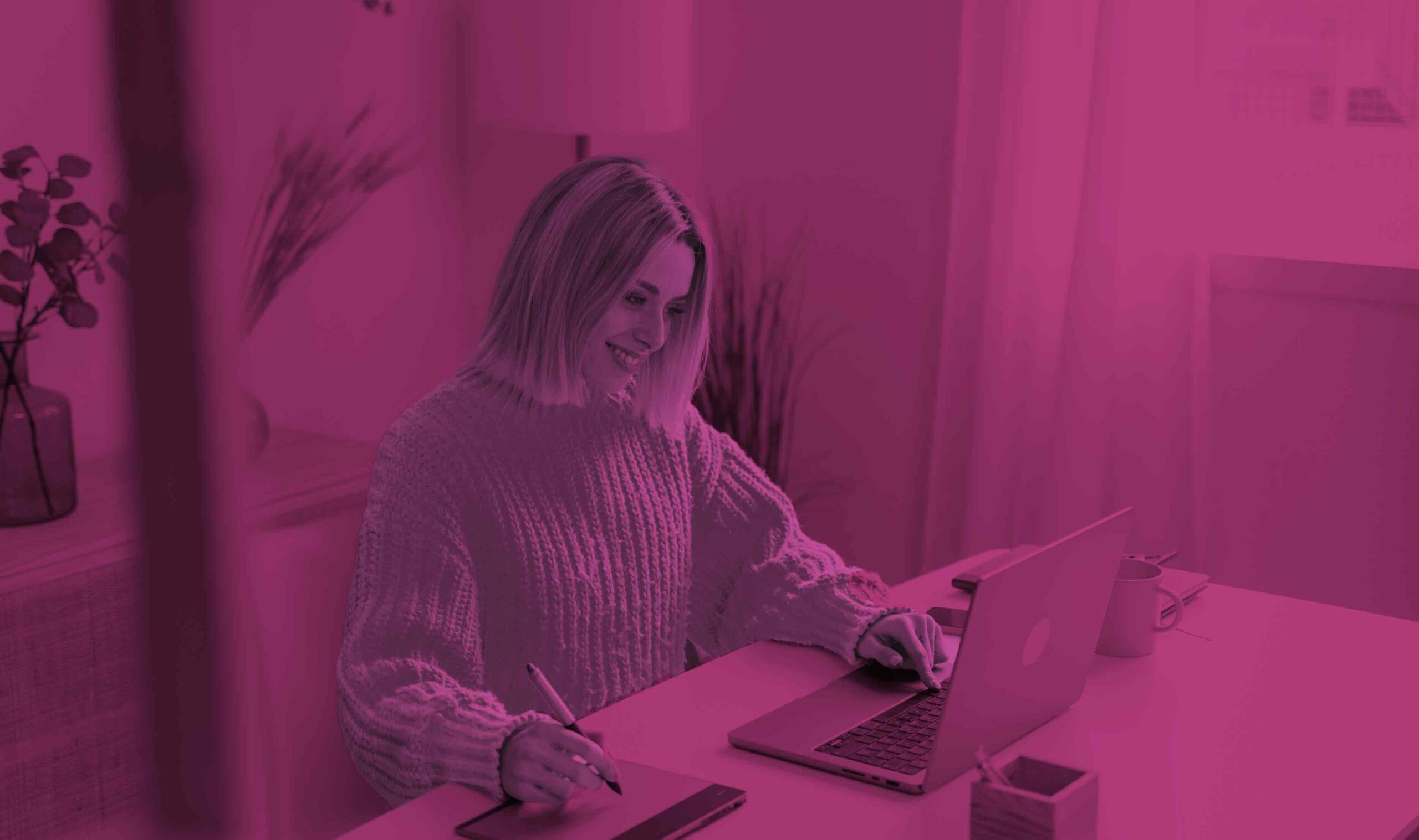 smiling employee working on a computer