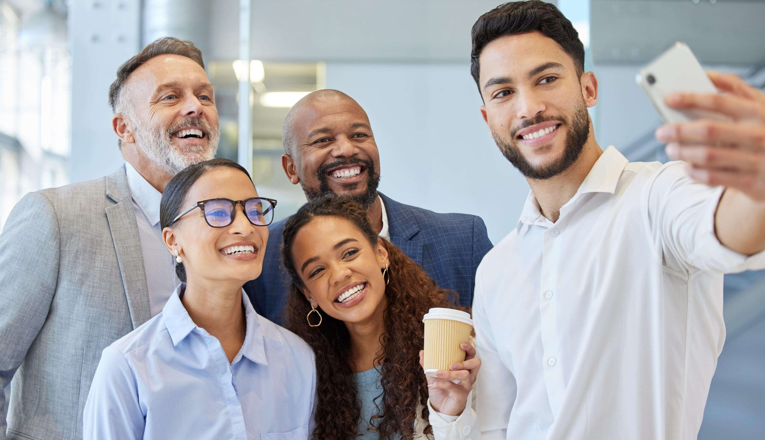 shot-of-a-group-of-businesspeople-taking-selfies-t-2025-04-05-21-35-51-utc-min-1