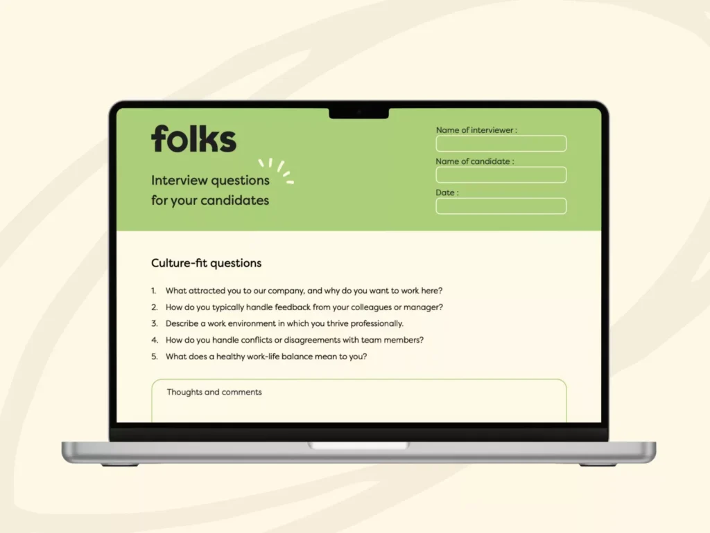A laptop screen displays an interview form titled