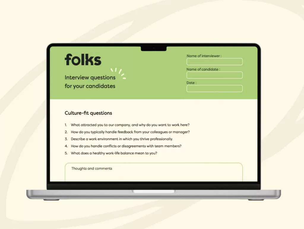 A laptop screen displays an interview form titled