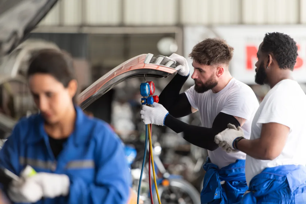 car mechanic workers in an auto repair shop